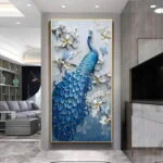 Luxury blue peacock wall art with floral accents in a modern living room setting.