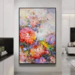 Modern floral wall art with vibrant colors in a sleek frame, enhancing luxury home decor.