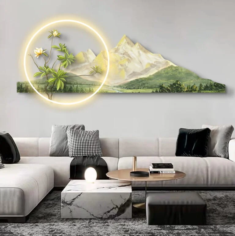 Modern illuminated wall art with mountain and floral design in a luxury living room setting.