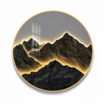 Modern luxury wall art with illuminated mountain design in a gold frame.