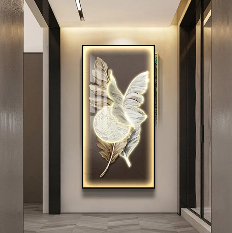 Illuminated modern wall art with leaf design in a hallway setting.