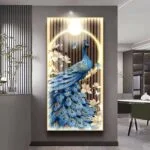 Illuminated wall art featuring a blue peacock with floral accents in a modern interior setting.