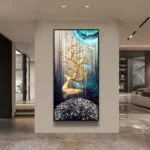 Modern luxury wall art with abstract deer and gold accents in a contemporary living room.