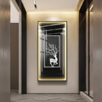 Illuminated modern wall art with deer design in a hallway setting.