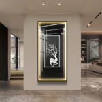 Modern illuminated wall art with deer design in luxury home setting.