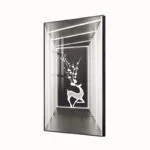 Illuminated wall art with deer and floral design in aluminium frame.