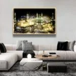Illuminated Kaaba wall art in modern living room setting.