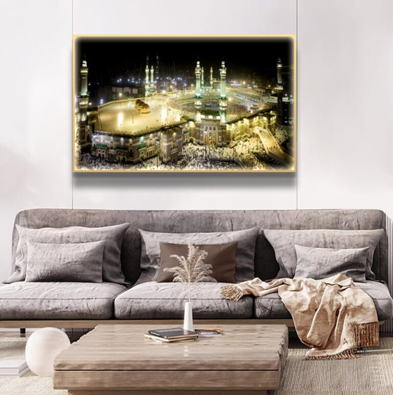Illuminated Kaaba wall art in a modern living room setting.