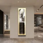 Illuminated modern wall art with horse sculpture in luxury home setting.