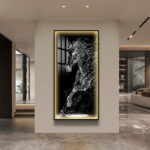 Modern illuminated wall art with abstract horse design in luxury home setting.