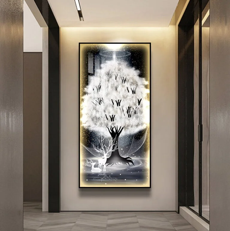 Illuminated modern wall art with tree design in a hallway setting.