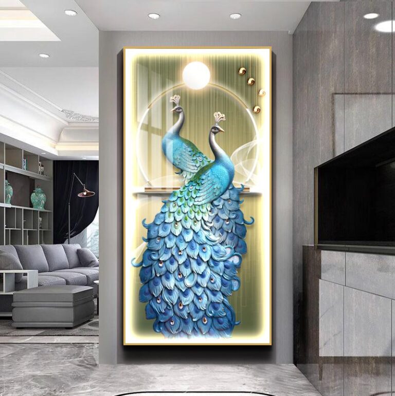 Illuminated wall art featuring two peacocks with vibrant blue feathers in a modern living room setting.