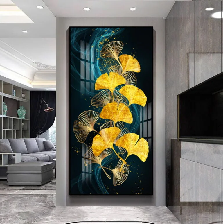 Modern luxury wall art with gold leaf design in a contemporary living room.