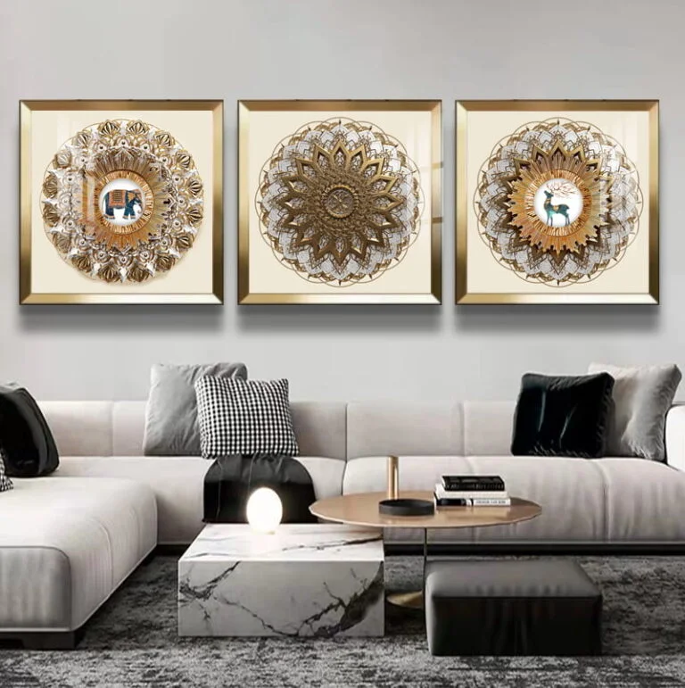 Luxury framed wall art with intricate designs above a modern living room sofa.