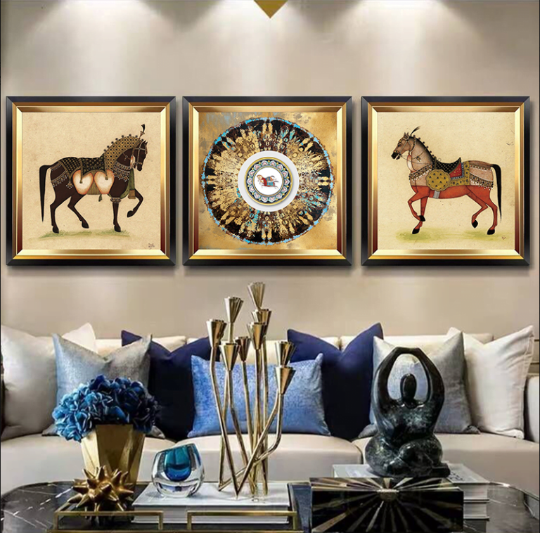 Luxury framed wall art with horse and abstract designs in a modern living room setting.
