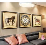 Luxury framed wall art with horse and abstract designs in a modern living room.
