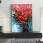Vibrant floral wall art with red roses in a modern living room setting.
