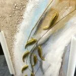 Modern abstract wall art with gold accents and textured design.