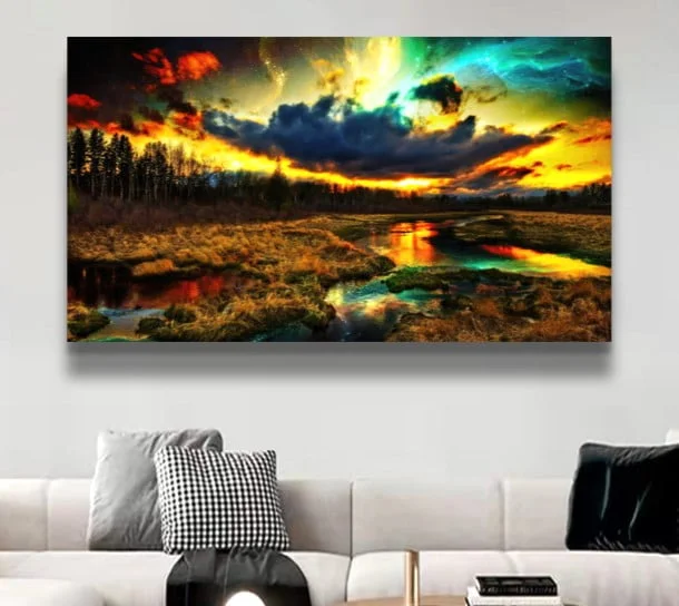 Modern wall art with a vibrant sunset landscape in a living room setting.