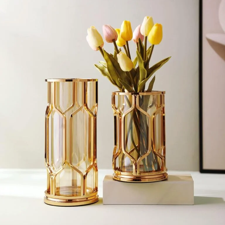 Elegant gold decorative vases with tulips, modern home decor.