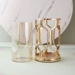 Elegant gold decorative vase with geometric design, perfect for modern luxury home decor.