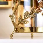 Gold decorative vase with leaf design, modern luxury home decor