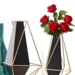 Modern geometric vases with gold frames and red roses, perfect for luxury home decor.