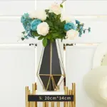 Modern geometric vase with flowers, luxury home decor accessory.
