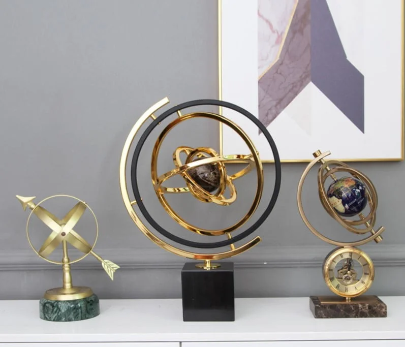 Luxury decorative sculptures and framed wall art in a modern home setting.