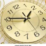Gold decorative wall clock with black hands and numbers, modern home decor.