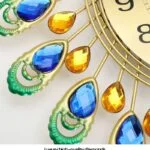 Luxury wall clock with colorful crystal accents and gold frame.