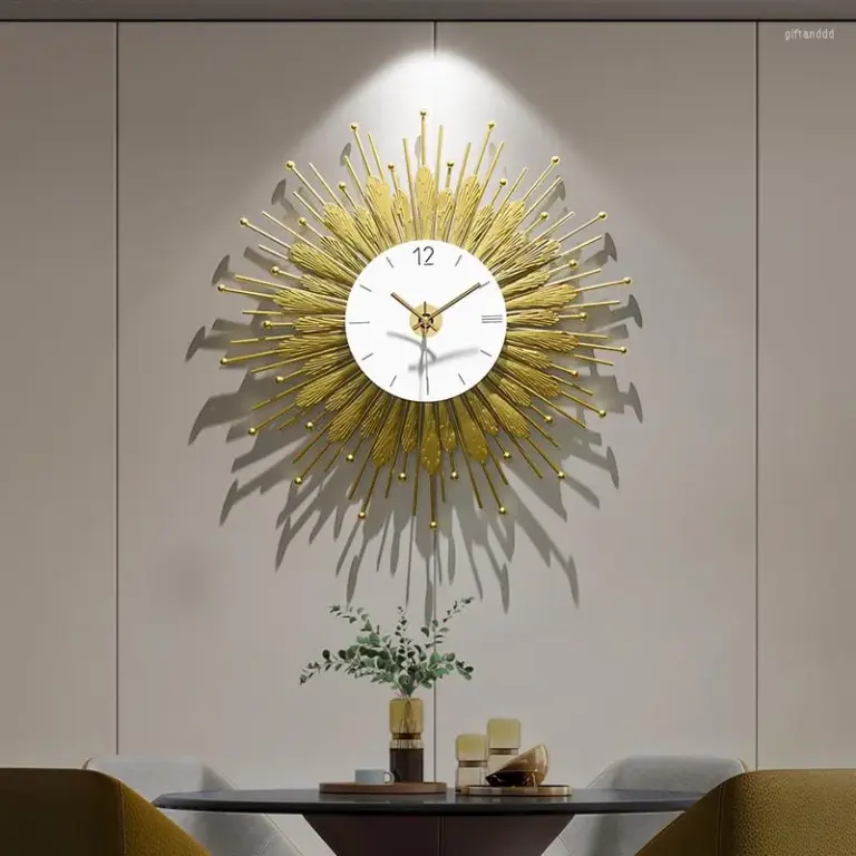 Modern luxury gold sunburst wall clock in a stylish interior setting.