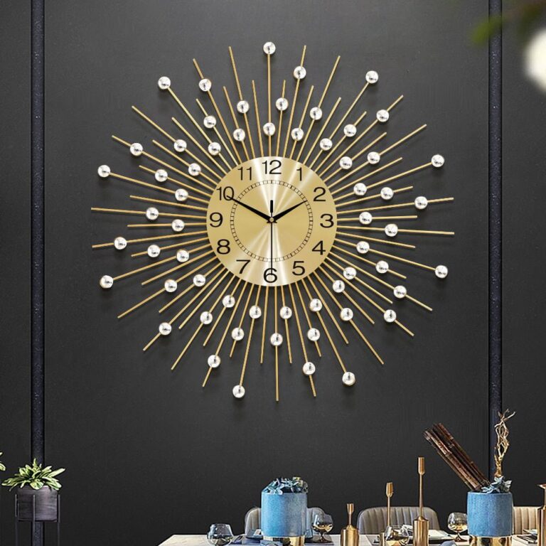 Modern luxury wall clock with gold and pearl accents on a dark wall, enhancing home decor.