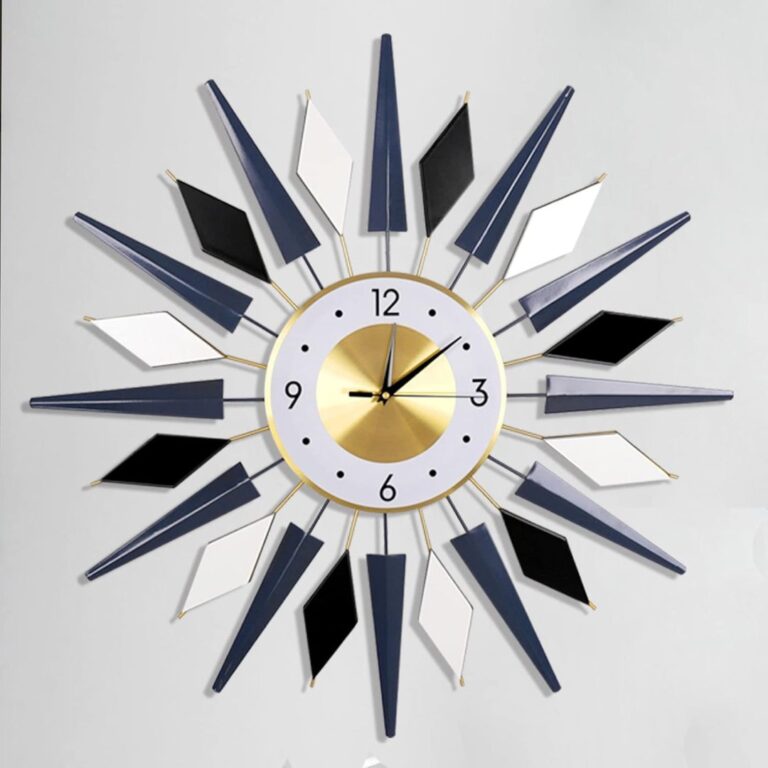 Modern decorative wall clock with geometric design and gold accents.