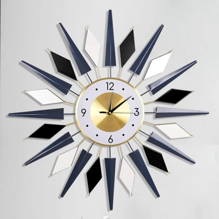 Modern decorative wall clock with geometric design and gold accents.