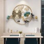 Luxury decorative wall clock with gold accents and floral design in a modern dining room.