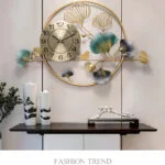 Modern decorative wall clock with floral accents in a luxury home setting.