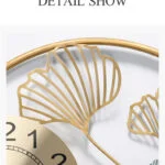 Modern luxury wall clock with gold accents and intricate design.