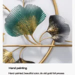 Gold and green metal wall art with leaf design, modern home decor.