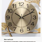 Gold decorative wall clock with black numerals and silent mechanism.