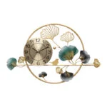 Modern luxury wall clock with gold frame and decorative leaf accents.