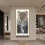 Illuminated modern wall art with tree and clock design in luxury home setting.