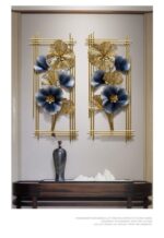 Luxury gold and blue floral wall art with metal frame in modern home decor setting.