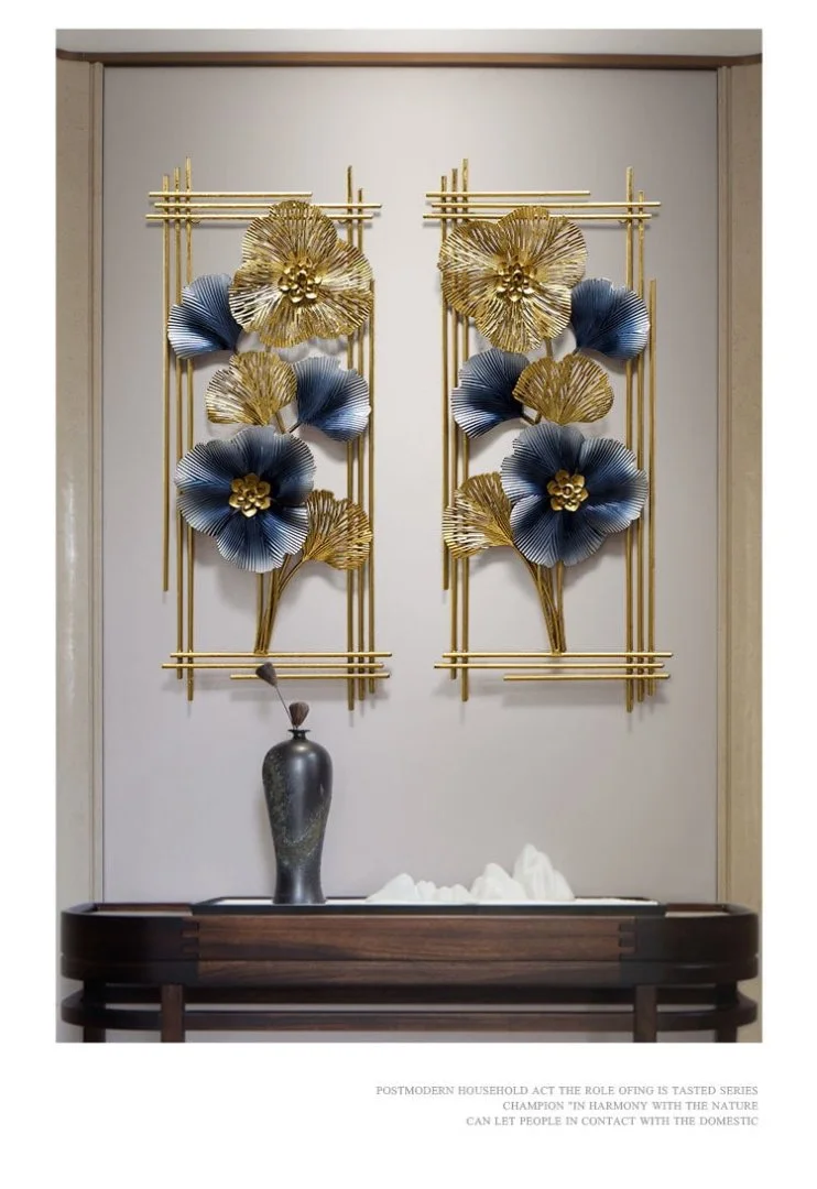 Luxury gold and blue floral wall art with metal frame in modern home decor setting.