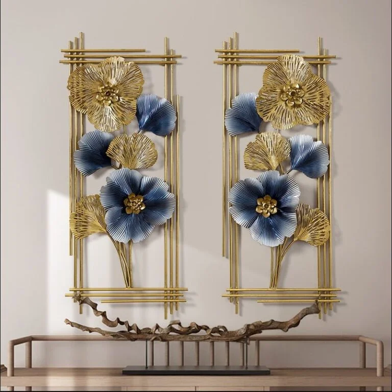 Gold and blue floral metal wall art in a modern home setting.