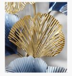 Gold and blue metal wall art with leaf design, modern home decor accent.