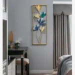 Modern luxury wall art with gold and blue floral design in a bedroom setting.