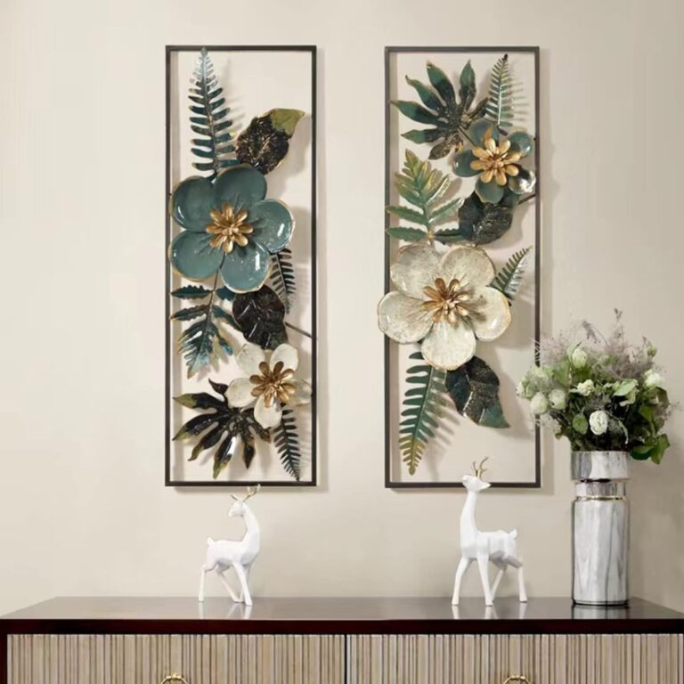 Modern floral wall art with metal frames above a console table with decorative deer figurines.