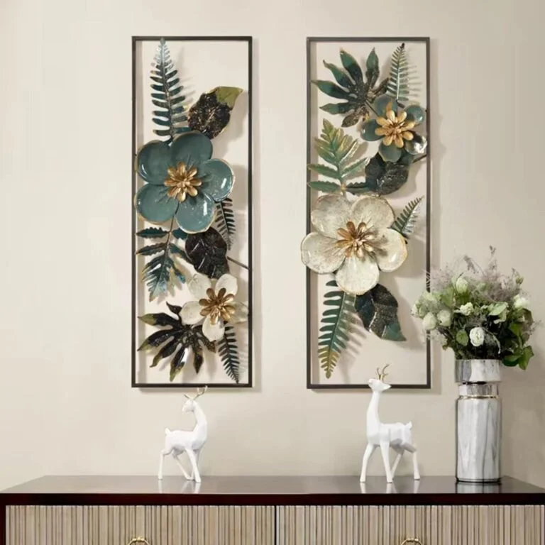 Modern floral wall art with metal frames above a console table with decorative deer figurines.