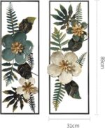 Modern floral wall art with green and gold accents in black frames.